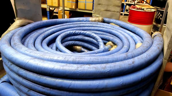 Heavy-duty concrete delivery hose coil